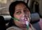 A COVID-19 patient sits inside a car and breathes with the help of oxygen provided by a Gurdwara, a Sikh house of worship, in New Delhi, India, Saturday, April 24, 2021. India’s medical oxygen shortage has become so dire that this gurdwara began offering free breathing sessions with shared tanks to COVID-19 patients waiting for a hospital bed. They arrive in their cars, on foot or in three-wheeled taxis, desperate for a mask and tube attached to the precious oxygen tanks outside the gurdwara in a neighborhood outside New Delhi. (AP Photo/Altaf Qadri)