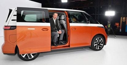Former Volkswagen Group CEO Herbert Diess poses in the German brand's Transporter ID Buzz.