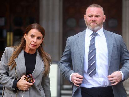 Coleen Rooney leaves the Royal Courts of Justice with her husband Wayne Rooney, Derby County Manager, in London, Britain May 16, 2022. REUTERS/Hannah McKay