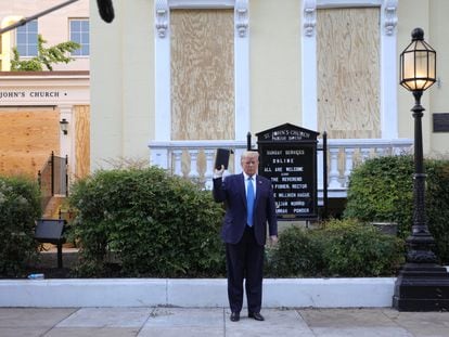 U.S. President Donald Trump holds up a Bible as he stands in front of St. John's Episcopal Church across from the White House after walking there for a photo opportunity amidst ongoing protests over racial inequality in the wake of the death of George Floyd while in Minneapolis police custody, near the White House in Washington, U.S., June 1, 2020. REUTERS/Tom Brenner