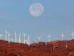 FILE PHOTO: The full moon sets behind a wind farm in the Mojave Desert in California, January 8, 2004.  Picture taken January 8, 2004.  REUTERS/Toby Melville/File Photo
