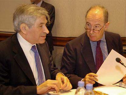 El presidente del Banco Mundial, Paul Wolfowitz, con el director del Fondo Monetario Internacional, Rodrigo Rato.