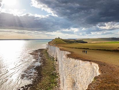 Panoramic view of Seven Sisters cliffs with lighthouse and sea