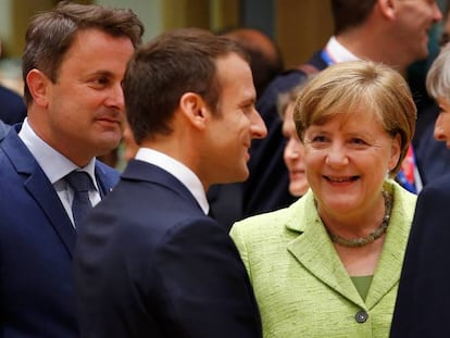 Emmanuel Macron, Angela Merkel y Theresa May.