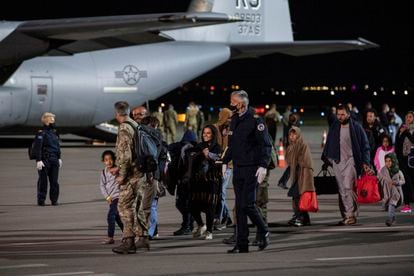 Afghan evacuees arrive at Pristina International Airport on a US military plane last August.