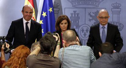 Luis de Guindos, Soraya Sáenz de Santamaría y Cristóbal Montoro.