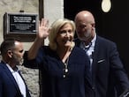 French far-right Rassemblement National (RN) party's leader and member of parliament Marine Le Pen (2ndL) leaves the city hall of Perpignan, southern France, on July 3, 2021, before taking part in a congress of the party. (Photo by RAYMOND ROIG / AFP)