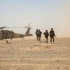 Afghan National Army 215th Corps troops disembark an Afghan Air Force (AAF) Black Hawk helicopter during a troop re-supply at Camp Shorabak in Helmand Province July 28, 2018. Picture taken July 28, 2018. To match Special Report USA-AFGHANISTAN/PILOTS.  U.S. Marine Corps/1st Lt. Kathleen Kochert/Handout via REUTERS THIS IMAGE HAS BEEN SUPPLIED BY A THIRD PARTY.