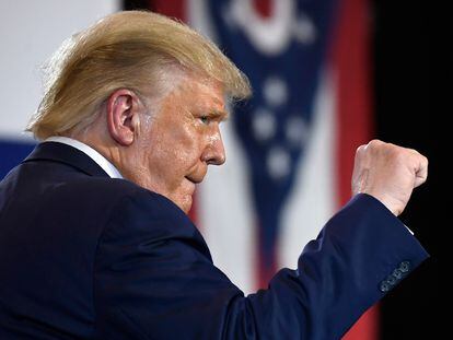 President Donald Trump pumps his fist as he finishes speaking during an event at the Whirlpool Corporation facility in Clyde, Ohio, Thursday, Aug. 6, 2020. (AP Photo/Susan Walsh)