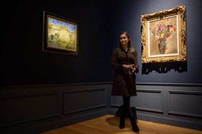 On the left, Vincent Van Gogh's painting 'Meules de ble' (1888) auctioned by Christie's in New York on November 11, 2021.