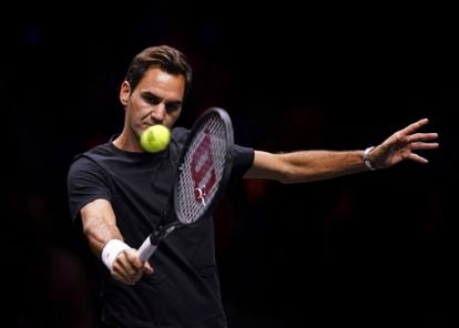 Federer hits the ball at the O2 Arena in London. 