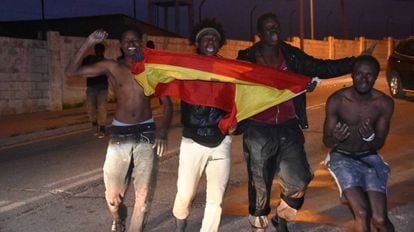 Would-be migrants celebrate getting across the Ceuta border fence in December 2016.