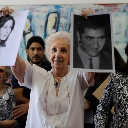 President of the Grandmothers of Plaza de Mayo human rights group, Estela de Carlotto, holds pictures of Maria del Carmen Moyano y Carlos Poblete, both disappeared during Argentina dictatorship in Buenos Aires, Argentina, Thursday, Dec. 28, 2017. The human rights group announced they have found the daughter of the couple, who was taken by the regime after Moyano gave birth to Polete's daughter while being a prisoner during the last military dictatorship in Argentina. (AP Photo/Natacha Pisarenko)