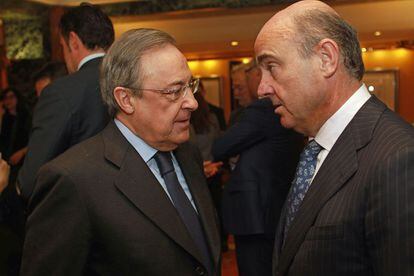 Florentino Perez, presidente de ACS y Luis de Guindos, ministro de Economía.