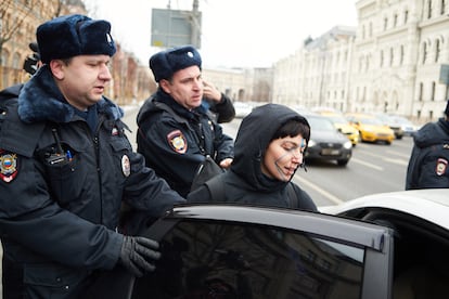 An activist who wears makeup to avoid facial recognition from Moscow cameras, is arrested by police during a protest against the video surveillance system, on February 9, 2020. / IVAN KRASNOV (RTVI)