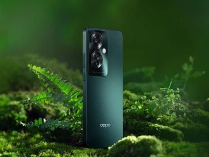 Teléfono OPPO Reno11 F 5G de color verde en naturaleza