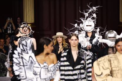 The designer Juan Martín (with a hat) leaving after his haute couture show at the fashion week in Paris, held this Thursday.