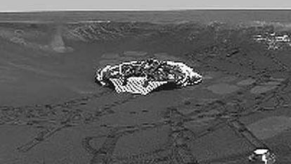 Panorámica del cráter con afloramientos rocosos en el que cayó <i>Opportunity,</i> tomada por el robot el lunes pasado desde el borde. Se observan las rodadas y la plataforma en la que llegó.