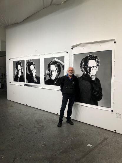 Gideon Lewin next to the photo of Avedon with a mask.