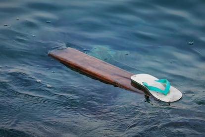 Photograph taken in March 2021, showing the remains of a sunken cayuco in the Port of Arguineguín, on the island of Gran Canaria. The cayucos are the safest vessels to face the Atlantic Ocean, as they are more resistant, but they also carry out the longest journeys. 