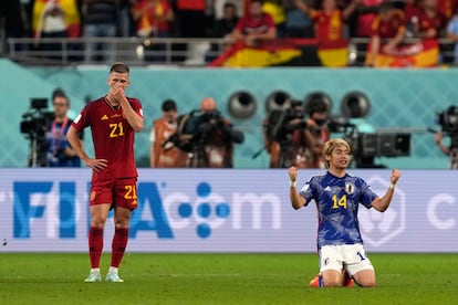 Japan's Junya Ito, right, celebrates next to Spain's Dani Olmo after the World Cup group E soccer match between Japan and Spain, at the Khalifa International Stadium in Doha, Qatar, Thursday, Dec. 1, 2022. Japan won 2-1. (AP Photo/Darko Vojinovic)