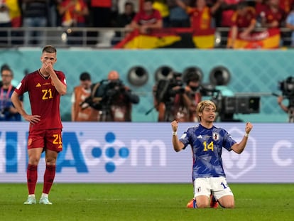 Japan's Junya Ito, right, celebrates next to Spain's Dani Olmo after the World Cup group E soccer match between Japan and Spain, at the Khalifa International Stadium in Doha, Qatar, Thursday, Dec. 1, 2022. Japan won 2-1. (AP Photo/Darko Vojinovic)