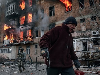 A local resident leaves his home after Russian shelling destroyed an apartment house in Bakhmut, Donetsk region.