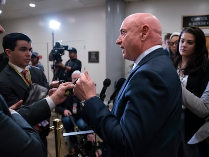 Senator Mark Kelly speaks with reporters following a classified briefing on China, at the Capitol in Washington on February 15, 2023.