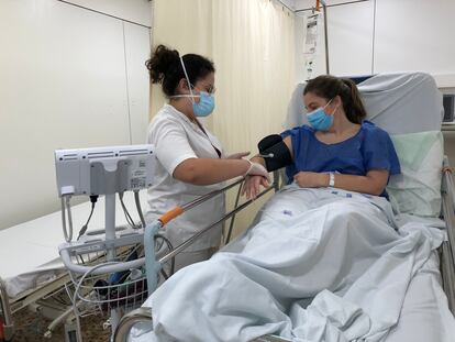 A health worker attends a suspected Covid-19 patient in Santa Caterina de Salt Hospital in Girona.