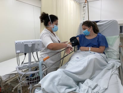 A health worker attends a suspected Covid-19 patient in Santa Caterina de Salt Hospital in Girona.