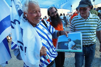 Avi Farhan, 78, shows a photo of his home in a Gaza settlement from which settlers were expelled in 2005.