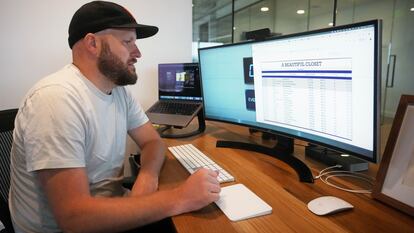 Jake Welch looks at a spreadsheet on his computer Wednesday, Aug. 2, 2023,