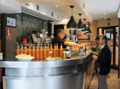 El Docamar (Alcalá 337) with its famous bottles of bravas sauce on the counter.