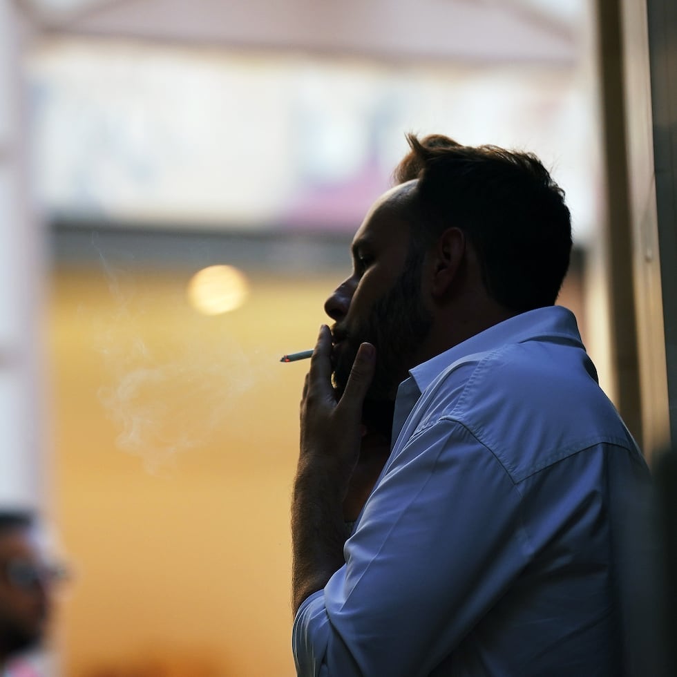 casual cigarette smoking Why social can be just as bad for you as daily smoking Young Man Smoking a Cigarette