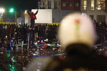 Morocco fans confront the police in Brussels.