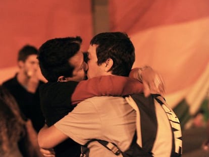 Two gay men kiss on the streets, as Uruguayan Chamber of Deputies approved the "Equal Marriage" law.