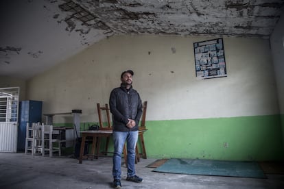 Local elementary teacher Yair Contador in a classroom. The school facilities suffer from corrosion and foul odors.