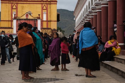 Dozens of people from Los Altos de Chiapas wait in line to receive remittances from the United States, in San Cristóbal de las Casas, Mexico, in December 2021. 