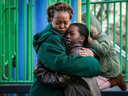 Derry Oliver, 17, right, hugs her mother, also Derry Oliver, during a visit to a playground near home, Friday, Feb. 9, 2024, in New York.