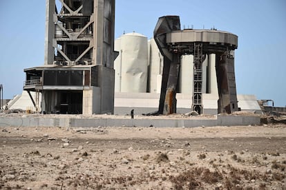 A civilian walks through the rubble caused by the SpaceX 'Starship' launch in Boca Chica.