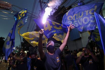 Supporters of Bruno Covas, mayor of Sao Paulo, celebrate his re-election during the municipal election in Sao Paulo, Brazil, November 29, 2020. REUTERS/Amanda Perobelli