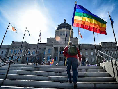 Demonstrators gather on the steps of the Montana state Capitol protesting anti-LGBTQ+ legislation in Helena, Mont., March 15, 2021.