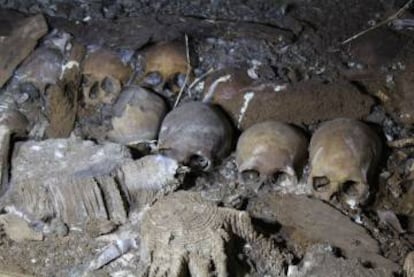 Skulls heaped within the Biniadrís cave in Menorca.