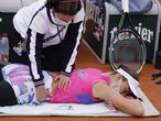 Paris (France), 05/10/2020.- Paula Badosa of Spain receives treatment during her 4th round match against Laura Siegemund of Germany during the French Open tennis tournament at Roland Garros in Paris, France, 05 October 2020. (Tenis, Abierto, Francia, Alemania, España) EFE/EPA/YOAN VALAT