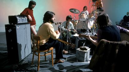 The Beatles, in the studio during the recording of 'Let It Be,' in January 1968, in a photo by Ethan A. Russell.
