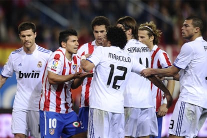 Agüero squares up to Marcelo during the match.