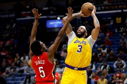 Anthony Davis #3 of the Los Angeles Lakers shoots over Herbert Jones #5 of the New Orleans Pelicans during the third quarter at Smoothie King Center on March 14, 2023 in New Orleans, Louisiana.