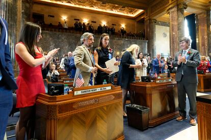 Senate President Cameron Henry, second left, receives applause from Republican senator Kirk Talbot, right, during the swearing in of the Louisiana state legislature in Baton Rouge, La., Monday, Jan. 8, 2024.