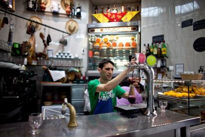 Bars in Lisbon do a healthy trade and are remarkable for their cleanliness and competitive prices. Pictured: Zé dos Cornos, which is famous for its grilled ribs and quail dishes.