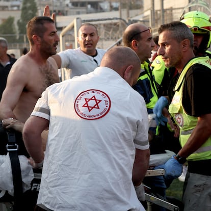 Majdal Shams (--), 27/07/2024.- Emergency service and locals attend the injured at the site where a projectile hit a playground in Druze, Majdal Shams, in the annexed Golan Heights, 27 July 2024. According to the Israel Defence Forces (IDF), a rocket launched from Lebanon toward Majdal Shams caused multiple civilian casualties, including children. Approximately 30 projectiles were identified crossing from Lebanon, the IDF said. (Líbano) EFE/EPA/ATEF SAFADI
